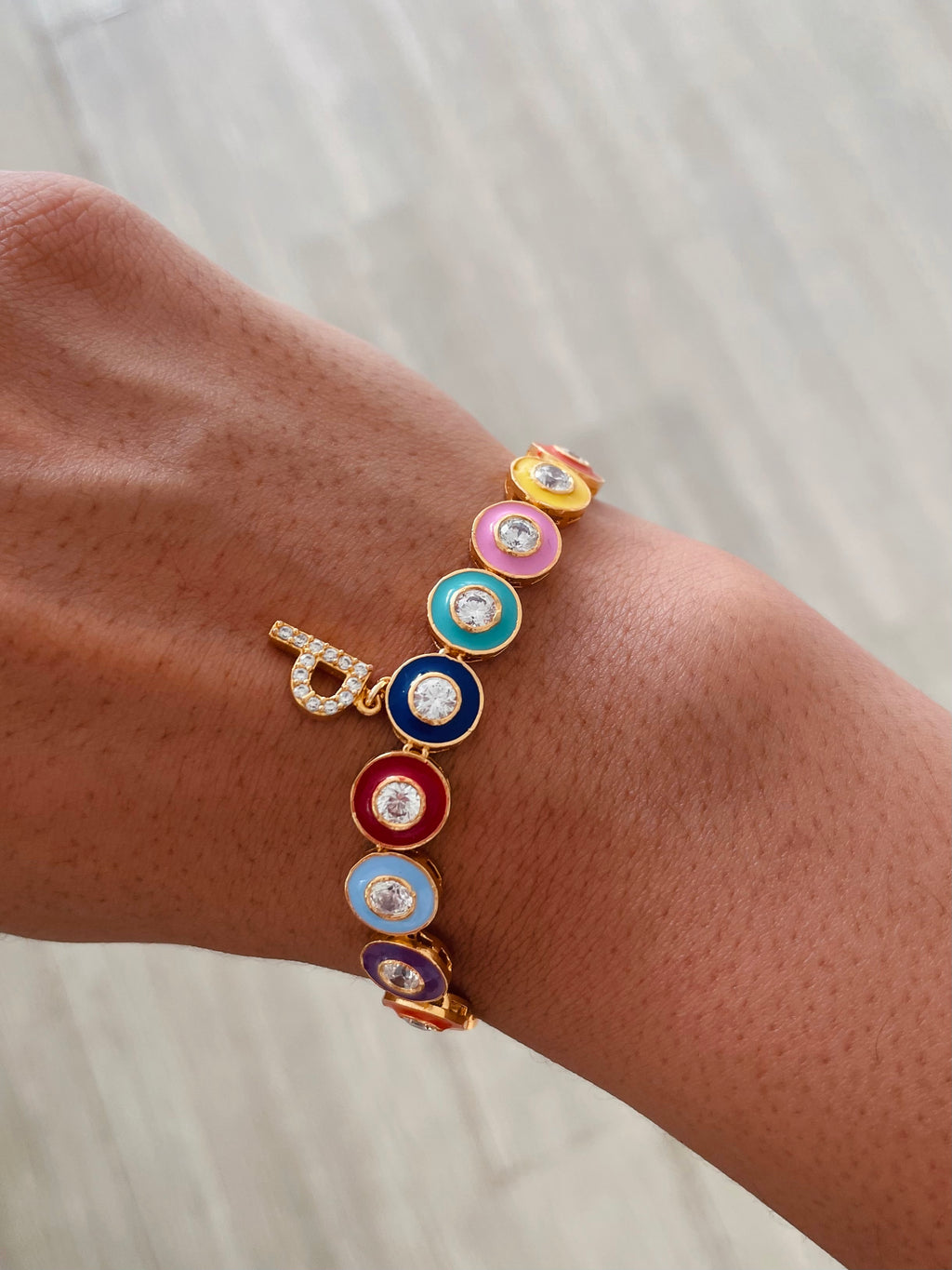 Personalised Multi Colour Single Letter Bracelet by Prerto — worn on wrist