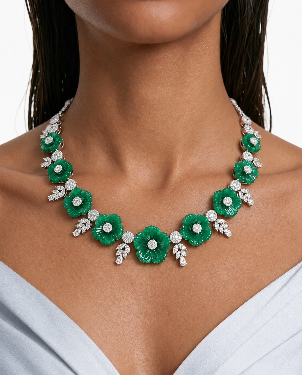 Feya emerald-green floral necklace with sparkling centres and leaf detailing, worn on a model