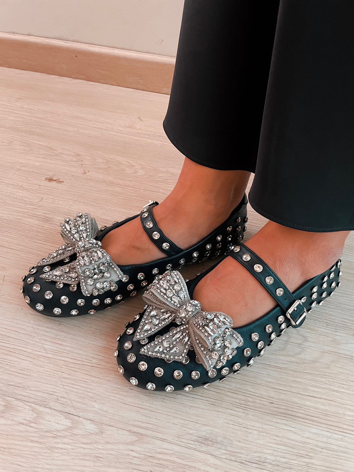 Black Dimonte Studs Bow Embellished Ballerina Shoes by Prerto — side view