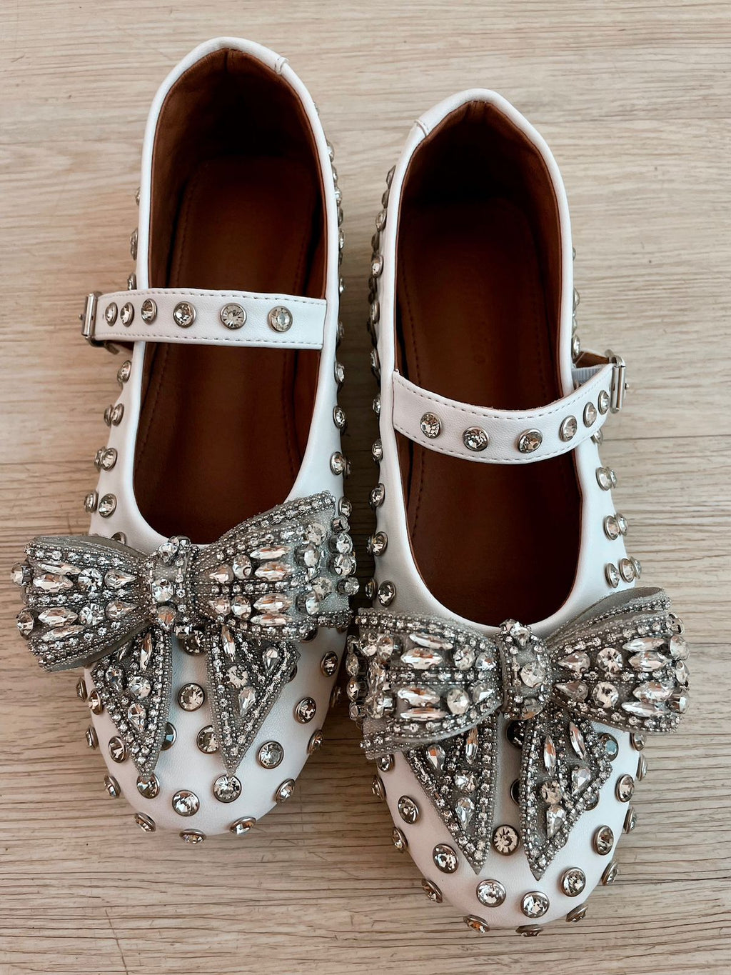 White Dimonte Studs Bow Embellished Ballerina Shoes by Prerto — front view