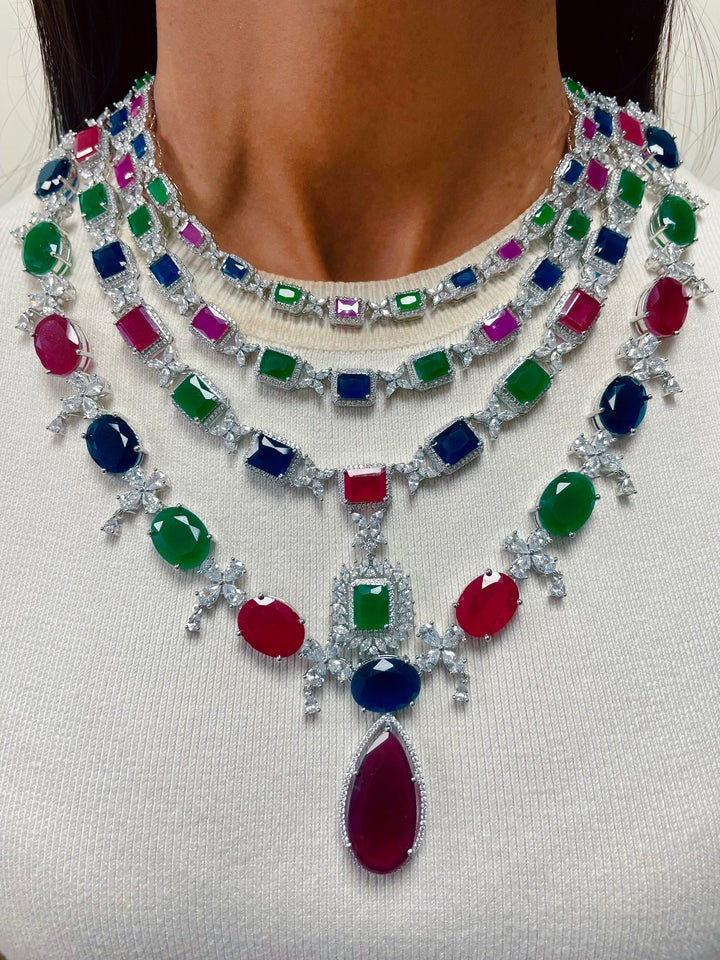 Aarohi Emerald, Ruby and Diamond-Like Zircon with Enamel Detailing Necklace Set & Eshika 4 Layered Multicolour Diamond Statement Necklace Set (Maharani Set)