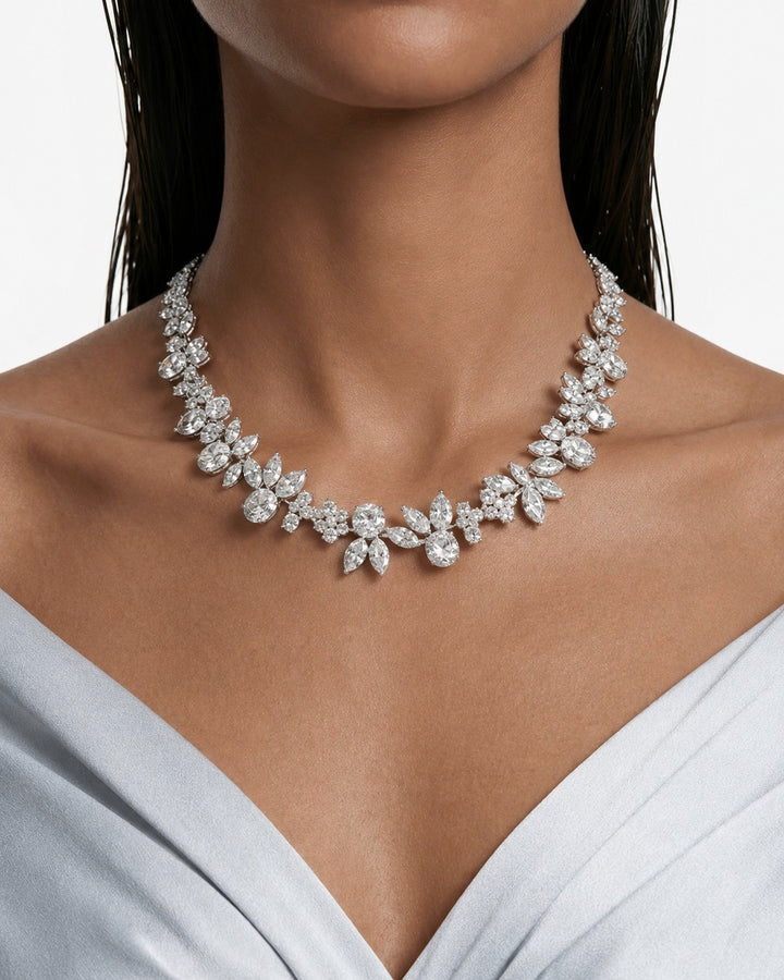 Maharani The Ivy Diamond-Like Zircon Statement Necklace & Nayara Diamond-Like Zircon Leaf Petal Choker Necklace Set – 2 Necklaces & Earrings