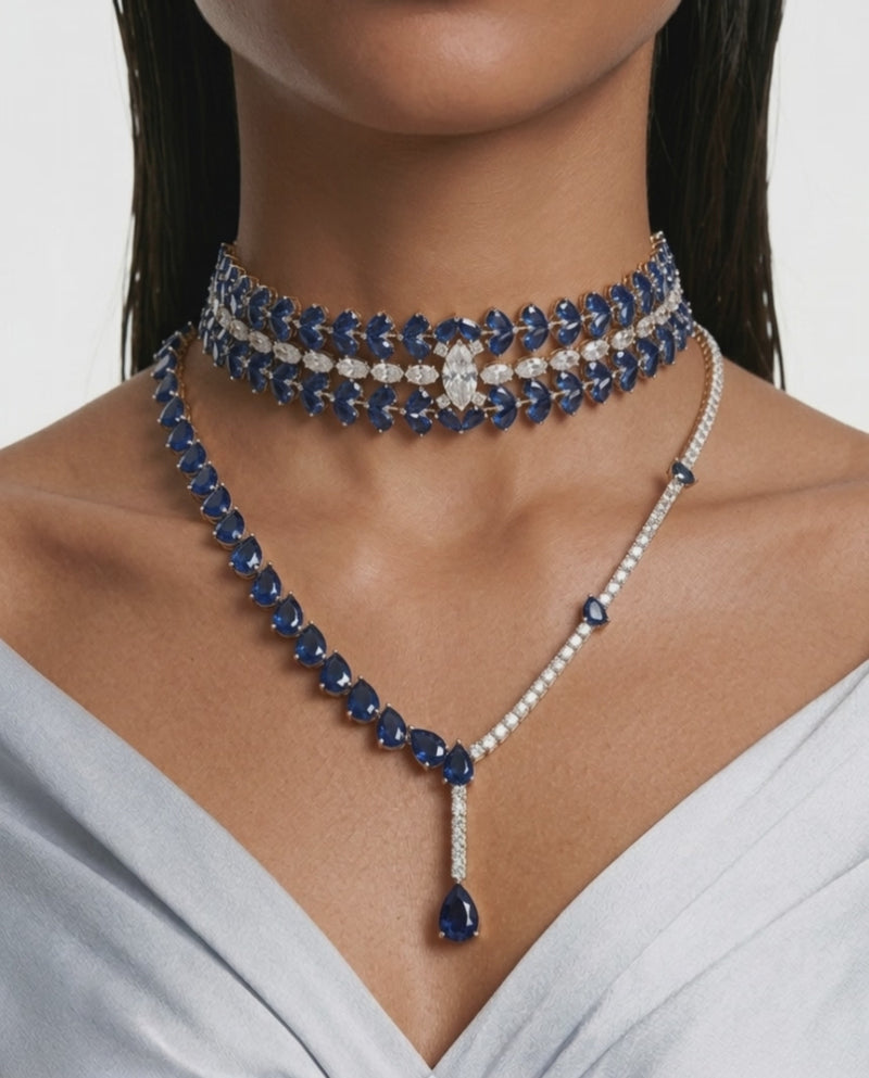 Maharani Amani Sapphire and Diamond-Like Zircon Drop Pendant Statement Necklace & Nayara Sapphire Diamond-Like Zircon Leaf Petal Choker Necklace Set – 2 Necklaces & Earrings