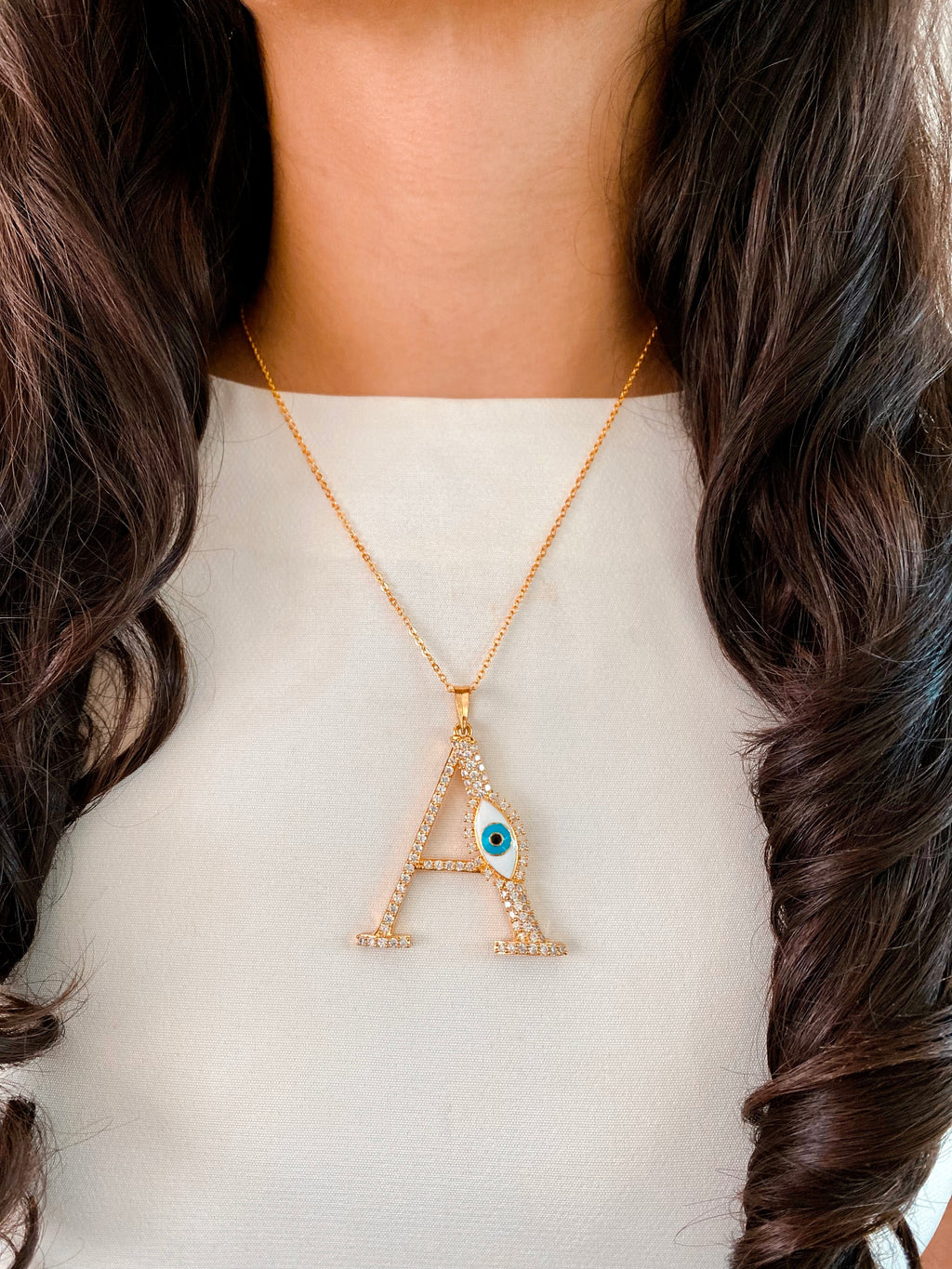 Evil Eye Gold Initial Pendant Necklace — angled view — Prerto