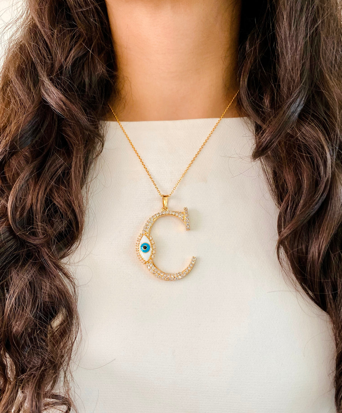 Evil Eye Gold Initial Pendant Necklace — flat lay — Prerto
