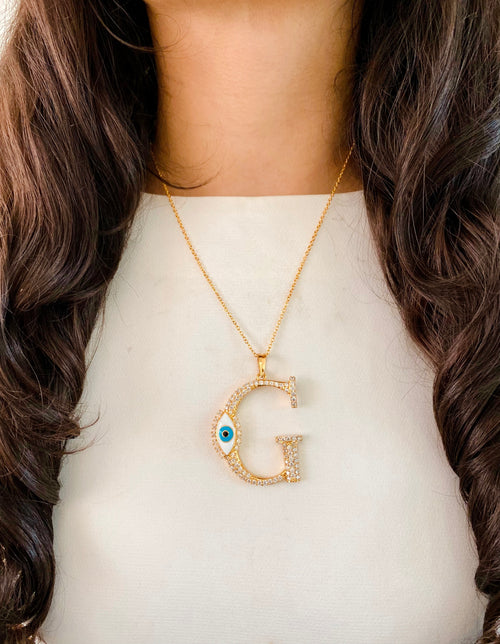 Evil Eye Gold Initial Pendant Necklace — worn on model — Prerto