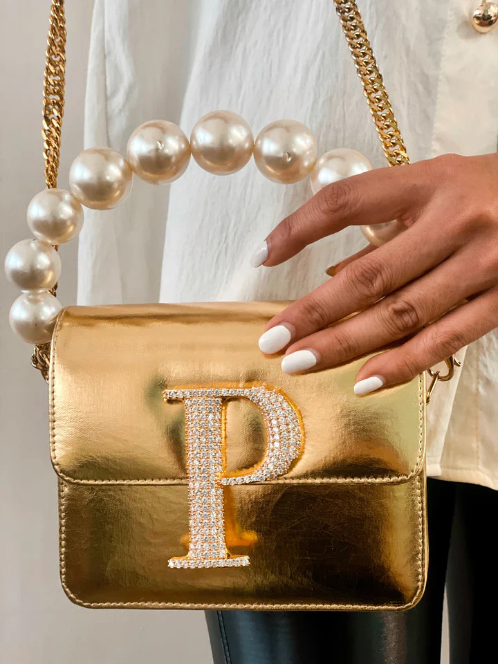 Personalised Gold Crossbody Bag by Prerto — flat lay